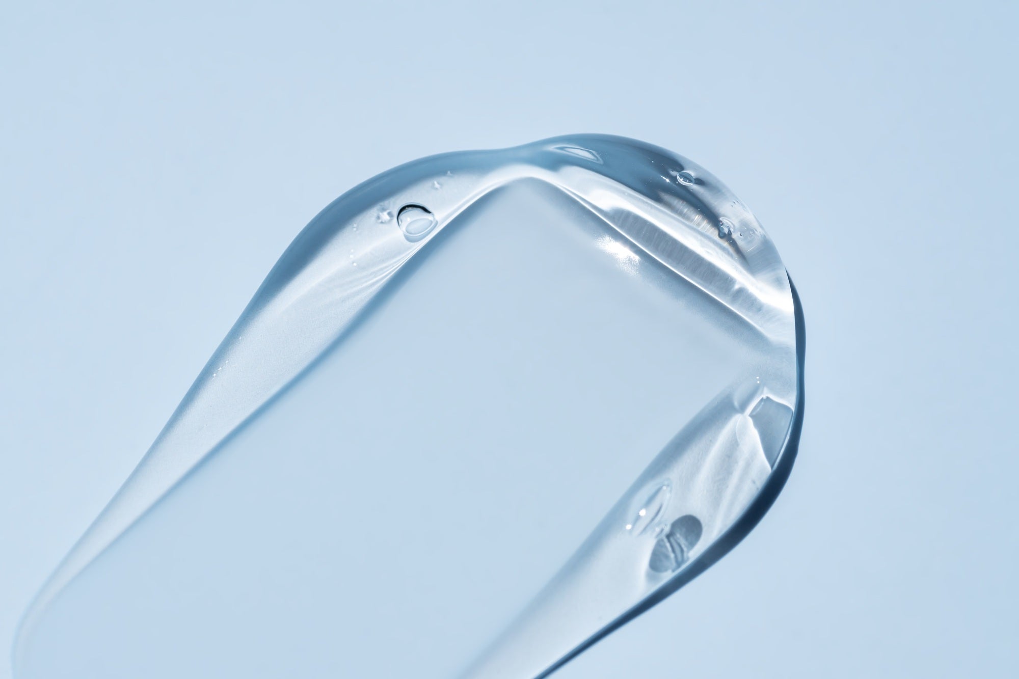 glycerin gel texture transparent serum smear on blue background liquid gel moisturizer with bubble – PerioTrap